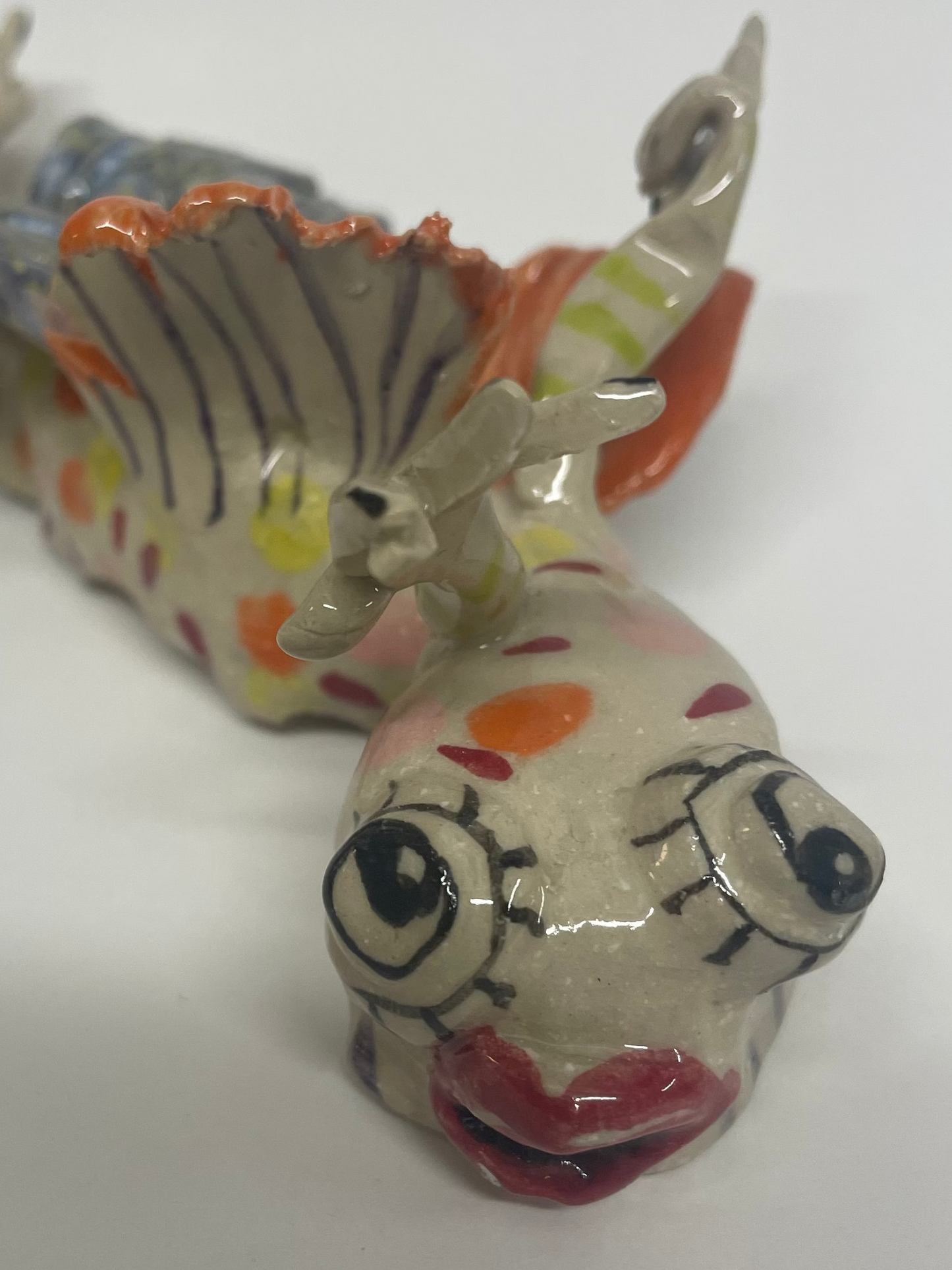 Vims keramik figur til at hænge på væggen (orange)